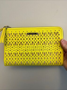 Neon Yellow Laser-Cut Zip Wallet by kate spade